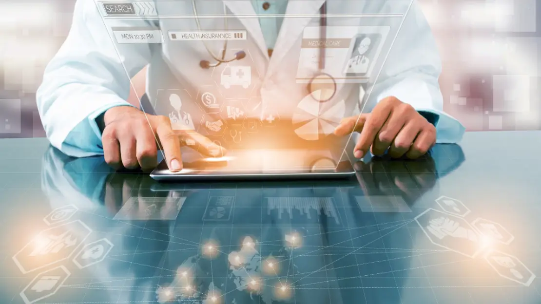 Doctor in white coat using a tablet with floating digital healthcare interface graphics